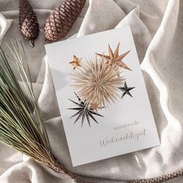 A6 greeting card with textured paper and decorative stars, suitable for Christmas celebrations.