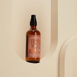 Organic lemon and orange scented toilet perfume in a 100ml amber glass bottle with a black spray nozzle.