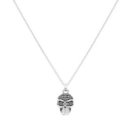  A silver-toned skull pendant necklace with a gothic, edgy style.