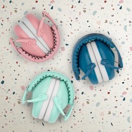 Hearing protector for children in pastel colors including pink, blue, and mint. Designed with a soft, comfortable fit and adjustable headband for a secure and customized fit.