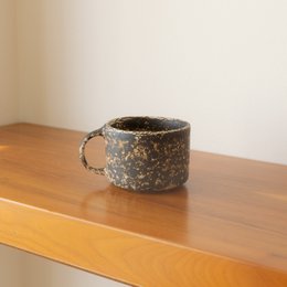  Brown ceramic coffee cups with speckled glaze finish.