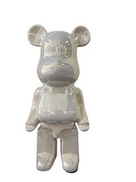  A white ceramic bear statue measuring 28cm in height.