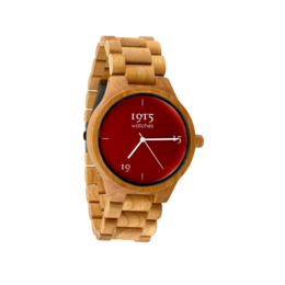 A wooden watch with a red dial and gold-toned accents, featuring a 46mm case size.