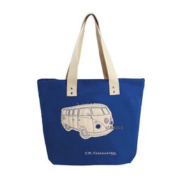 A blue canvas tote bag with a silhouette of a Volkswagen VW T1 Bus printed on it. The bag has beige handles and appears to be a shopping or reusable grocery bag.
