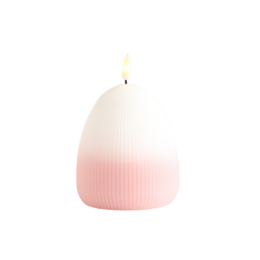 White egg-shaped LED candle with a flickering flame, sitting on a pastel-colored box.