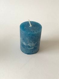 A tall, cylindrical blue candle with a wick.