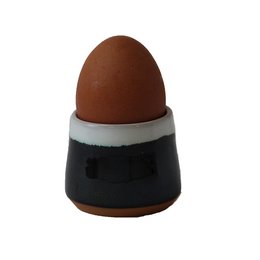 Two-tone black and white ceramic egg cup with a rounded, tapered shape.