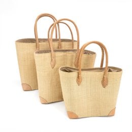 Natural woven handcrafted basket, tan beige color, leather handles, rectangular shape, storage organizer.