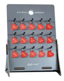 Red heart-shaped key fobs with black metal accents.