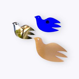 Protest pin featuring blue and beige dove-shaped patches, representing peace and unity for Ukraine.