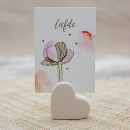 Blush, linen, and sand stone card holder with a heart-shaped design and floral illustration.
