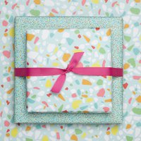 Colorful wrapping paper turquoise with terrazzo pattern, children pack gifts for children's birthday, for school or at birth