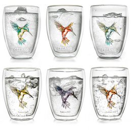 A set of 6 double-walled thermal glasses featuring colorful hummingbird designs. The glasses are 250 ml in capacity and available in blue, red, green, orange, purple, and yellow.