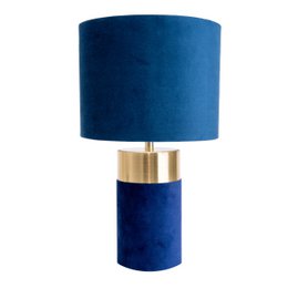 A tall, cylindrical table lamp with a navy blue velvet shade and a brass base.