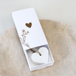  Small white gift box with heart-shaped soap inside, perfect for gifting.