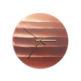 Polished copper wall clock with a modern, minimalist design featuring a round shape and layered copper tones.