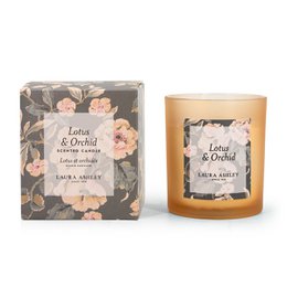 A tall, round candle in a gift box with the scent of lotus and orchid. The candle is part of the Laura Ashley collection and features a floral design on the packaging.