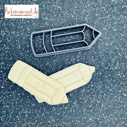 Pencil-shaped baking decoration, made of white material, with a simple, minimalist design.