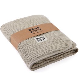 Soft, fluffy brown muslin fleece baby blanket with a cozy, textured waffle weave design.