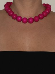  Fuchsia beaded necklace with bold, round beads.