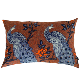 A large, rectangular cushion with a vibrant peacock design in shades of rust and blue. The cushion features a detailed peacock motif with intricate floral patterns, creating a bold and eye-catching accent piece.