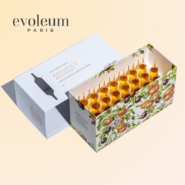 Radiance drinkable cosmetic supplement in orange packaging. Contains liquid formula in yellow-orange color.