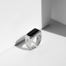 Silver and gold signet ring with a square black stone, available in various sizes.