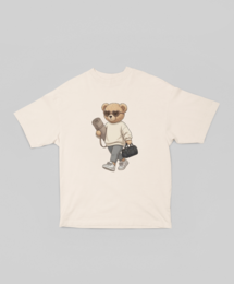  Oversized white t-shirt with a Pilates bear graphic. Available in sizes XS-3XL and colors white, black, and ecru.