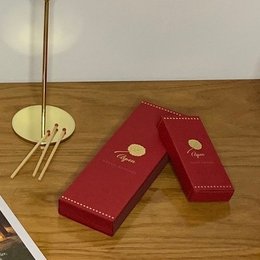 Red, extra-long scented matches in a decorative red box with gold accents.