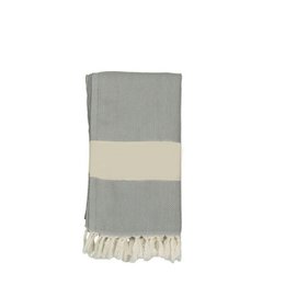 A light gray and cream striped hammam towel with tasseled edges, suitable for use as a beach or bath towel.
