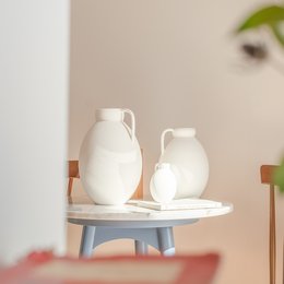 Elegant white ceramic vases with reed diffusers, available in small and large sizes, perfect for home decor.