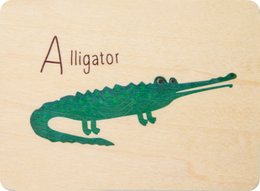 Wooden cards with an illustrated alligator. The cards are designed for children and feature the letter "A" and the word "Alligator" written in a cursive font.