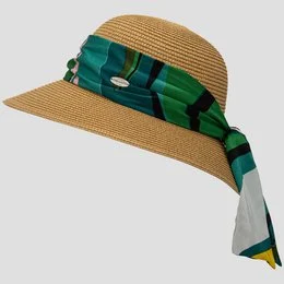 A wide-brimmed straw sun hat with a colorful patterned scarf tied around the crown. The hat is made of woven straw in a beige color and features a large brim that provides ample sun protection. The scarf is made of a vibrant mix of orange, red, and brown patterns, adding a stylish accent to the hat.