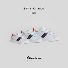 White casual sneakers with velcro straps, suitable for kids' sports activities.