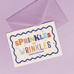  Colorful "Sprinkles Wrinkles" birthday card with wavy border design and purple envelope included.