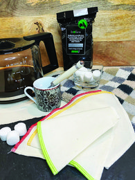 Linen coffee filter set with 3 reusable filters in white, green, and red colors. Durable and washable for eco-friendly coffee brewing.