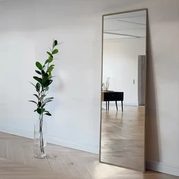  Taupe-colored standing mirror with slim steel frame, available in 55x195 cm and 60x225 cm sizes, suitable for home decor.