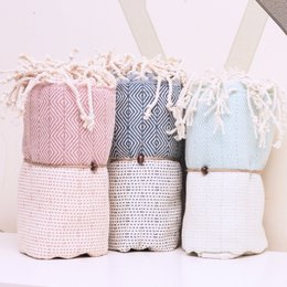  Soft, absorbent Turkish towels in a variety of colors and patterns, including petrol, salmon, sax blue, mint, black, purple, and fuchsia. Made of 100% cotton with a textured diamond pattern and fringe trim.