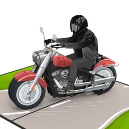 A red and silver motorcycle pop-up card with a person riding it on a green background.