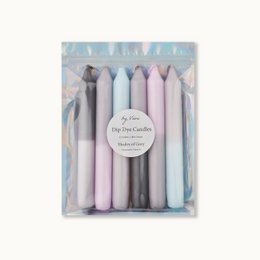Set of 8 dip-dyed candles in shades of grey and pastel colors. Cylindrical candle shape. Suitable for use as dinner candles.