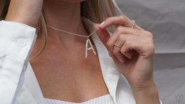  Pendant necklace with a minimalist 'A' charm in silver or gold color.