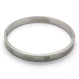 A silver-colored cuff bracelet with the text "Pinkiez" and "Hope" engraved on it. The bracelet appears to be made of metal and has a simple, minimalist design.