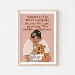 Wall art featuring a portrait of Josephine Baker with inspirational text. The artwork depicts a woman with a white dress, leopard print accessories, and a headpiece. The text reads "You are on the one of a complete woman. The world is waiting for you."