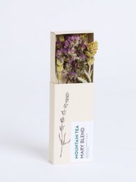  "Mini tea blend with dried purple flowers and chamomile, white minimalist packaging, herbal tea mix"
