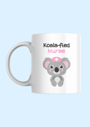A white ceramic mug featuring a cute koala wearing a nurse's cap. The mug is labeled "Koala-fied Nurse".