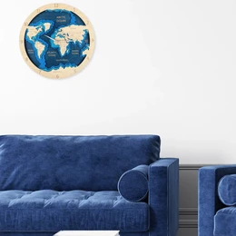  A round world map clock with a wooden frame, showing the continents and oceans in shades of blue.