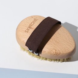  Dry brush with natural bristles for exfoliating skin. Wooden body with brown strap.