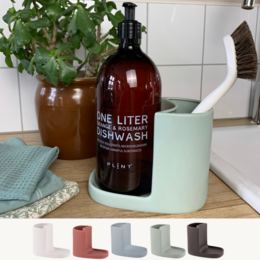 Ceramic soap dish in white, terracotta rose, ice, leaf, and almost black colors. Rectangular shape with a curved design.