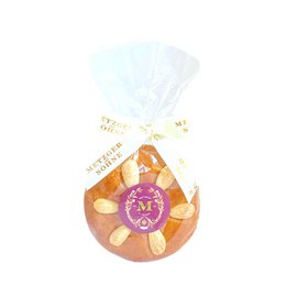  Honey gingerbread almond slice, a delicious praline with a golden-brown color, featuring a mix of honey, gingerbread, and almonds.