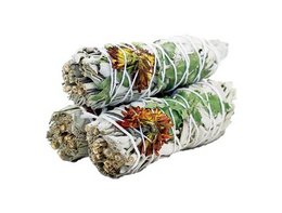 A bundle of sage incense sticks with a natural, earthy appearance. The sage leaves are wrapped in a green leaf, creating a rustic and calming aesthetic.